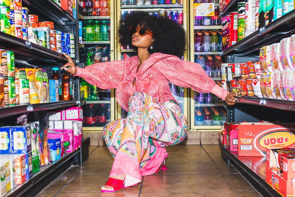 Fashionable Woman Buying Snacks at a Grocery Store